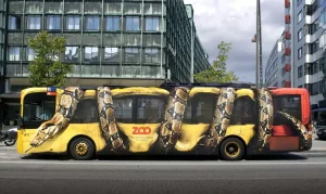 Copenhagen's Unconventional Canvas: The Giant Snake Bus Advertisement